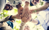 Hands Together For Teamwork And Success 2026 03 19 - Large
