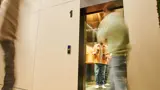 Adult Waits In Elevator With Coffee Cups 2026 03 11 06 56 22 Utc