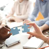 Teamwork With Puzzle Pieces In A Bright Office 2026 02 05 20 30 00 Utc